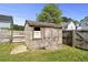 A storage shed in the backyard, enclosed by a wood fence at 4747 Lewis And Clark Trl, Summerville, SC 29485