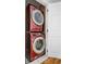 Efficient laundry area with stacked washer and dryer for space-saving convenience at 4979 Lake Palmetto, North Charleston, SC 29418