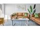 Living room featuring stylish couches, patterned rug, modern decor and ample natural light at 4979 Lake Palmetto, North Charleston, SC 29418