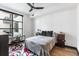 Cozy bedroom with natural light, comfortable bed, and simple furnishings, including a desk at 5 Gadsdenboro St # 416, Charleston, SC 29401