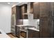 Close up of modern kitchen features stainless steel appliances, light countertops, and dark cabinetry at 5 Gadsdenboro St # 416, Charleston, SC 29401