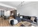 Open-concept living room and kitchen with modern furnishings, hardwood floors, and recessed lighting at 5 Gadsdenboro St # 416, Charleston, SC 29401