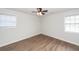 Bedroom featuring neutral walls, wood-look floor, and ample natural light at 521 Savannah Rd, Ladson, SC 29456
