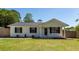 Charming single-story home featuring a freshly painted exterior and a well-manicured lawn at 521 Savannah Rd, Ladson, SC 29456