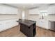 Kitchen featuring stainless steel appliances, stylish island, stone countertops, and ample cabinet space at 521 Savannah Rd, Ladson, SC 29456