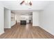 Open living space featuring modern floors, fresh paint, and views into the kitchen with island at 521 Savannah Rd, Ladson, SC 29456