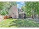 Spacious backyard featuring a screened-in porch, wood fence, and ample room for outdoor activities at 5400 Rock Creek Ct, North Charleston, SC 29420