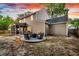 A house backyard featuring a patio with outdoor furniture and a beautiful sunset at 5400 Rock Creek Ct, North Charleston, SC 29420