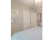 Bright bedroom featuring two closets, a mirror, and neutral tones for a serene atmosphere at 5400 Rock Creek Ct, North Charleston, SC 29420