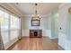 Dining room with hardwood floors, stylish light fixture and a large window for natural light at 5400 Rock Creek Ct, North Charleston, SC 29420