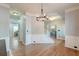 Elegant dining room featuring hardwood floors, crown molding and wainscotting detail at 5400 Rock Creek Ct, North Charleston, SC 29420