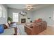 Living room featuring a fireplace, ceiling fan, hardwood floors and a cozy ambiance at 5400 Rock Creek Ct, North Charleston, SC 29420