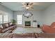 Inviting living room with a fireplace, a ceiling fan and comfortable seating at 5400 Rock Creek Ct, North Charleston, SC 29420