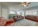 Spacious living room with hardwood floors, ceiling fan and two comfortable leather couches at 5400 Rock Creek Ct, North Charleston, SC 29420