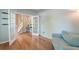 Bright living room showcasing hardwood floors, French doors and a comfortable blue couch at 5400 Rock Creek Ct, North Charleston, SC 29420