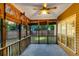 Cozy screened porch with a ceiling fan, and wood accents, offering a serene outdoor space at 5400 Rock Creek Ct, North Charleston, SC 29420