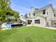 Expansive backyard showcasing a pool, outdoor seating, and a well-maintained lawn at 5403 Diston Ct, North Charleston, SC 29420