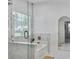 Spa-like bathroom featuring a glass-enclosed shower, soaking tub, marble accents, and a stylish mirror at 5403 Diston Ct, North Charleston, SC 29420