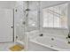 Bright bathroom featuring a luxurious tub with a walk-in glass shower at 5403 Diston Ct, North Charleston, SC 29420