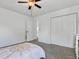 Bright bedroom with plush carpet, ceiling fan, closet, and adjacent Bedroom area, offering comfort and functionality at 5403 Diston Ct, North Charleston, SC 29420