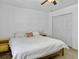 The bedroom features a queen-sized bed, side tables, a ceiling fan, and neutral colors at 5403 Diston Ct, North Charleston, SC 29420