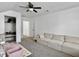 The upstairs bonus room is open and bright with neutral colors and plenty of natural light at 5403 Diston Ct, North Charleston, SC 29420