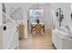 Open dining room features a modern chandelier, neutral decor, and seamless flow into the adjacent living areas at 5403 Diston Ct, North Charleston, SC 29420