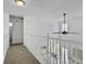 Bright hallway with a view overlooking the living room, featuring a modern ceiling fan and carpeted floor at 5403 Diston Ct, North Charleston, SC 29420