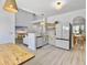 Open-concept living featuring a kitchen with stainless steel appliances and adjacent dining space at 5403 Diston Ct, North Charleston, SC 29420