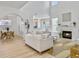 Bright living room with fireplace, light wood floors, and stylish furnishings at 5403 Diston Ct, North Charleston, SC 29420