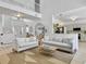 Bright, open-concept living area with modern decor, comfortable seating, and a view of the staircase at 5403 Diston Ct, North Charleston, SC 29420