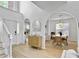 Spacious living area features arched doorways, a console table, and seamlessly integrates dining and living spaces at 5403 Diston Ct, North Charleston, SC 29420