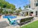A beautiful backyard patio includes outdoor seating, a covered deck and a beautiful view of the pool at 5403 Diston Ct, North Charleston, SC 29420