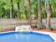 The backyard includes an in-ground pool with waterfall features and mature trees at 5403 Diston Ct, North Charleston, SC 29420