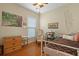 Cozy bedroom with wood floors, soft lighting, and a neutral color palette offers a relaxing personal space at 559 Eastern Isle Ave, Summerville, SC 29486