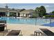 Large community pool with lounge chairs and umbrellas, perfect for relaxation and recreation at 559 Eastern Isle Ave, Summerville, SC 29486