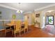 Traditional dining room with wood floors, decorative rug, chandelier, and artwork adds character to this home at 559 Eastern Isle Ave, Summerville, SC 29486