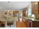 Spacious kitchen boasts granite countertops, stainless steel appliances, and a large center island at 559 Eastern Isle Ave, Summerville, SC 29486