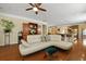 An open-concept floor plan with hardwood floors connects the living room, dining area, and kitchen for easy entertaining at 559 Eastern Isle Ave, Summerville, SC 29486