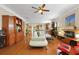 Spacious living room with hardwood floors, built-in cabinets, and large sectional sofa provides a comfortable gathering space at 559 Eastern Isle Ave, Summerville, SC 29486