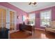Home office with hardwood floors, natural light, and decorative wall accents at 559 Eastern Isle Ave, Summerville, SC 29486