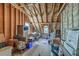 Unfinished attic space, displaying exposed wooden beams and plywood at 5950 Lowell Reed Rd, Ravenel, SC 29470