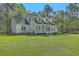Beautiful exterior view of the home, showcasing the well-maintained lawn and landscaping at 5950 Lowell Reed Rd, Ravenel, SC 29470