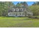 Inviting home with a covered front porch, set amidst mature trees at 5950 Lowell Reed Rd, Ravenel, SC 29470