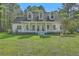 Charming home featuring a welcoming front porch and dormer windows at 5950 Lowell Reed Rd, Ravenel, SC 29470