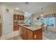 Well-lit kitchen with stainless steel sink, island, and eat-in dining area at 5950 Lowell Reed Rd, Ravenel, SC 29470