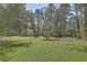 Property includes large backyard shed, plus space for tractors and other equipment at 5950 Lowell Reed Rd, Ravenel, SC 29470