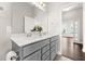 Bathroom featuring a double sink vanity, white countertop, a large mirror, and modern fixtures at 607 Heartwood Ln, Summerville, SC 29486