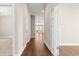 Hallway features hardwood flooring leading to a bright living space, enhancing the home's appeal at 607 Heartwood Ln, Summerville, SC 29486