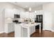 Modern kitchen features granite countertops, stainless steel appliances, and a functional center island at 607 Heartwood Ln, Summerville, SC 29486